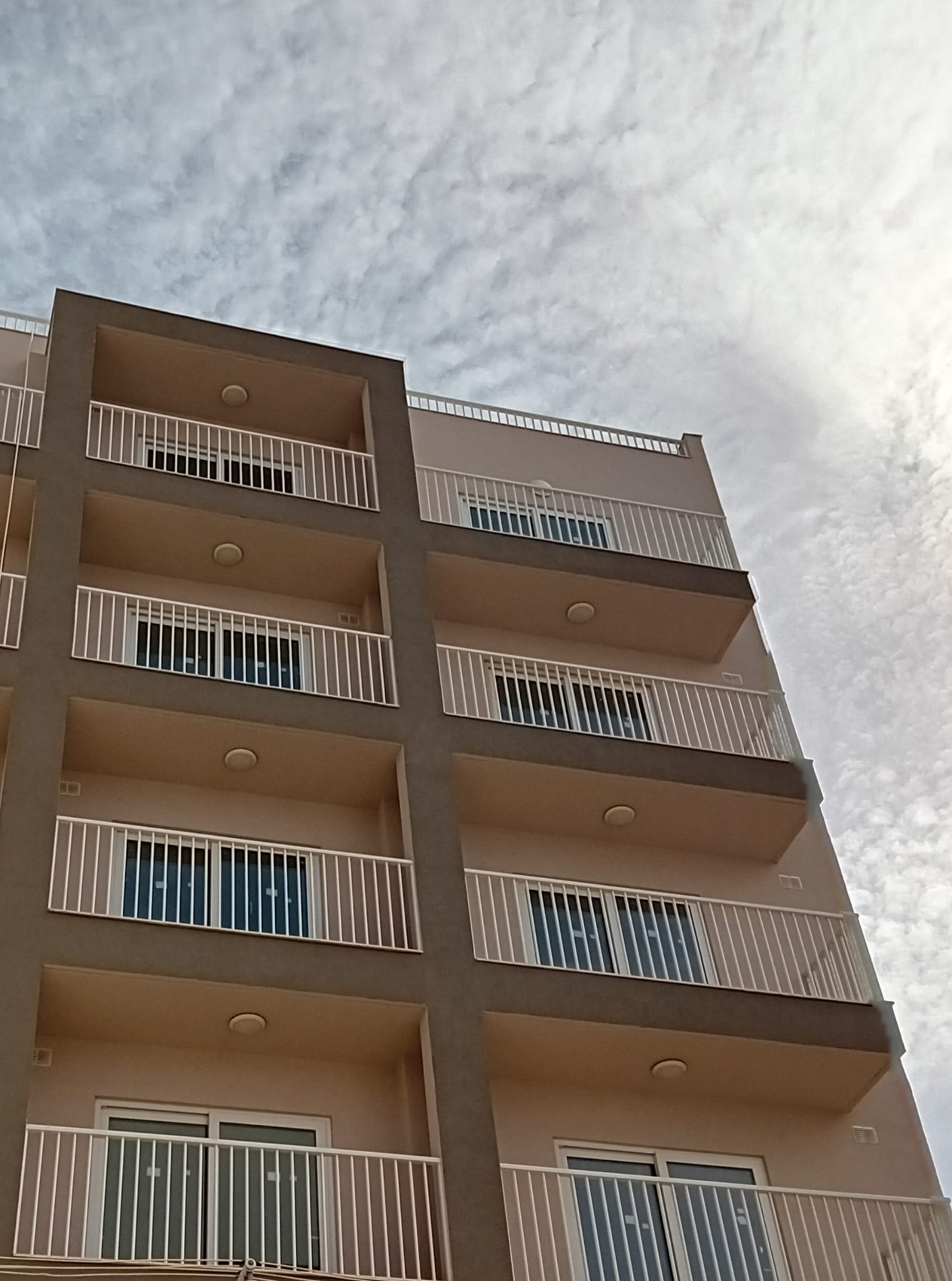 Balconies and glass balustrades of a newly built block