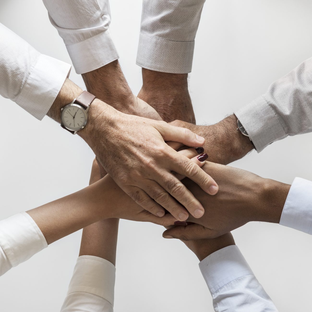 Hands joined together over a table