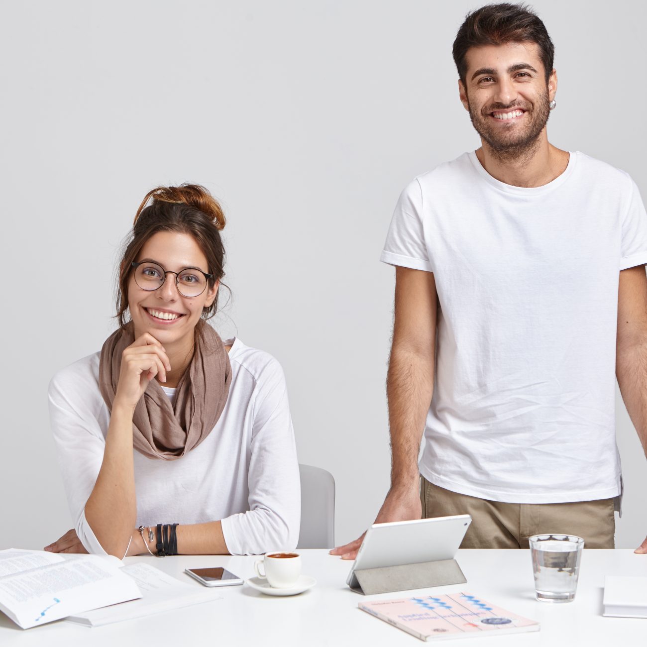 Two colleagues working together at a desk